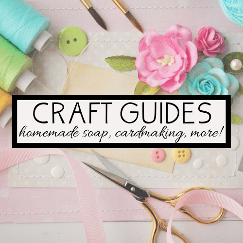 Assorted craft supplies including colorful threads, buttons, ribbons, flowers, and scissors are spread around a central sign. The sign reads Craft Guides: homemade soap, cardmaking, and more! on a pastel background, perfect for family fun and creativity.