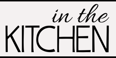 Text reading in the KITCHEN in black font on a white background, enclosed in a black rectangular border.