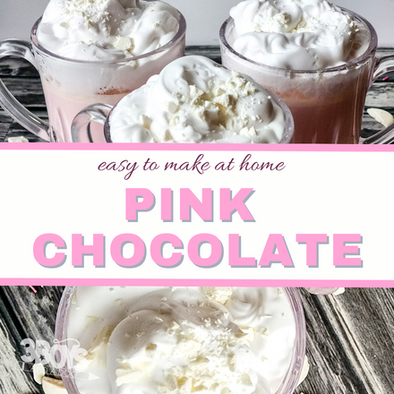 Three mugs filled with pink hot chocolate and topped with whipped cream are displayed. A text overlay reads easy to make at home PINK HOT CHOCOLATE RECIPE in pink and white colors.